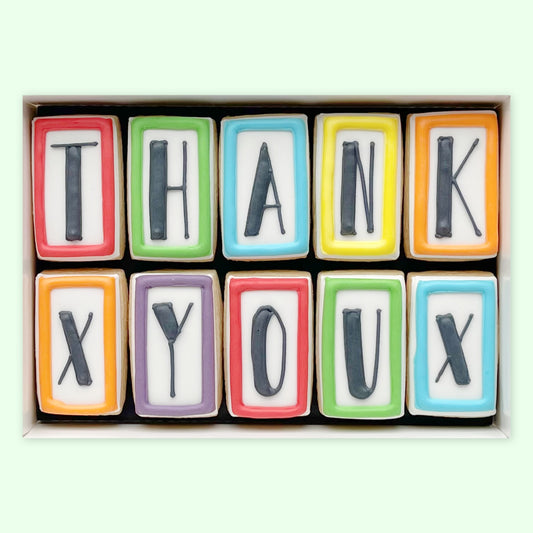 Hand iced Thank you letter biscuits in an open white gift box by katies biscuit shop