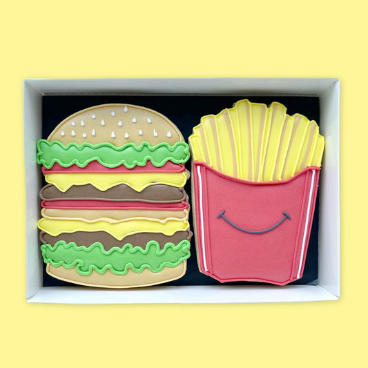 hand iced burger and fries biscuits in a open white gift box by Katie's Biscuit shop 