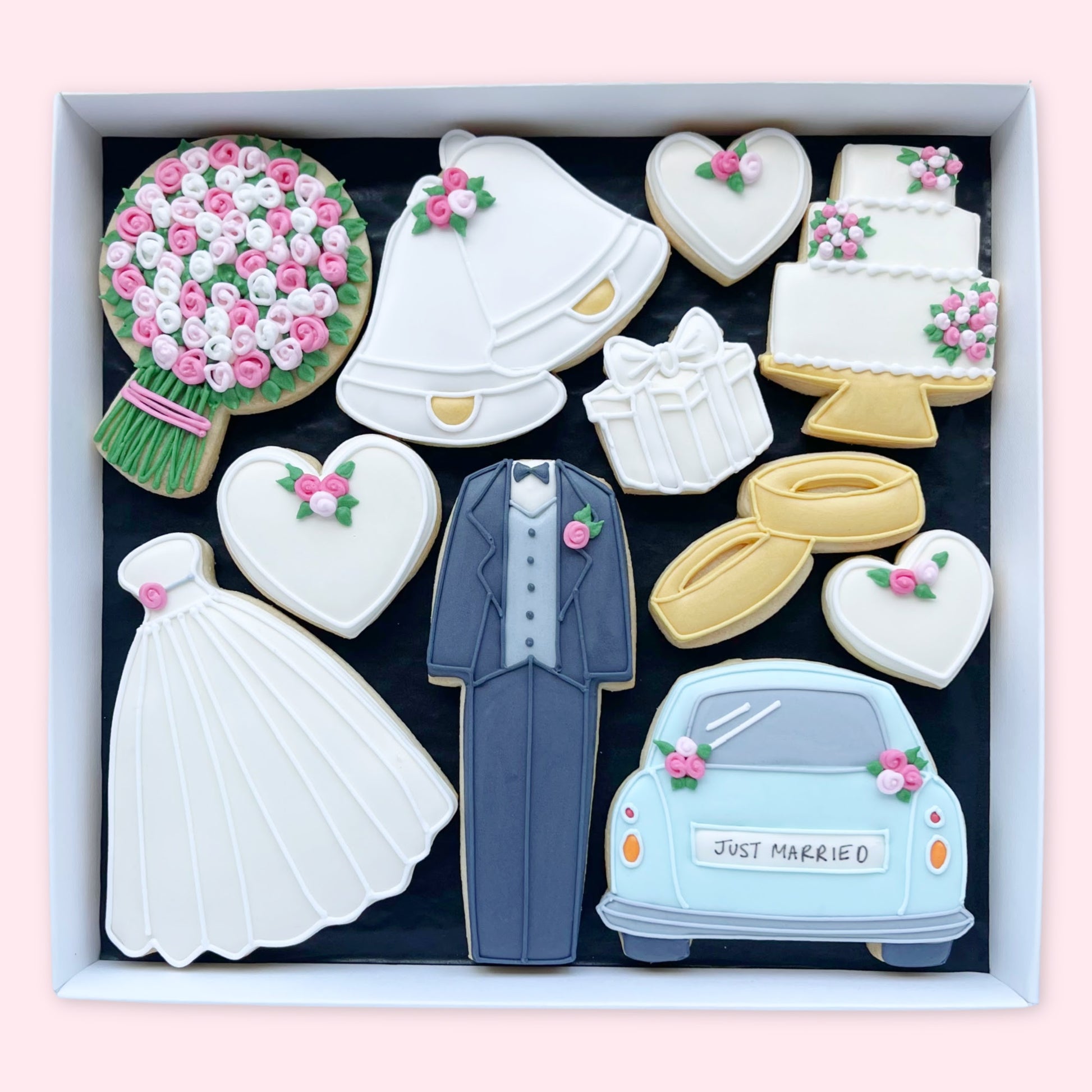Hand Iced wedding day theme biscuits in an open white gift box by Katie's Biscuit shop
