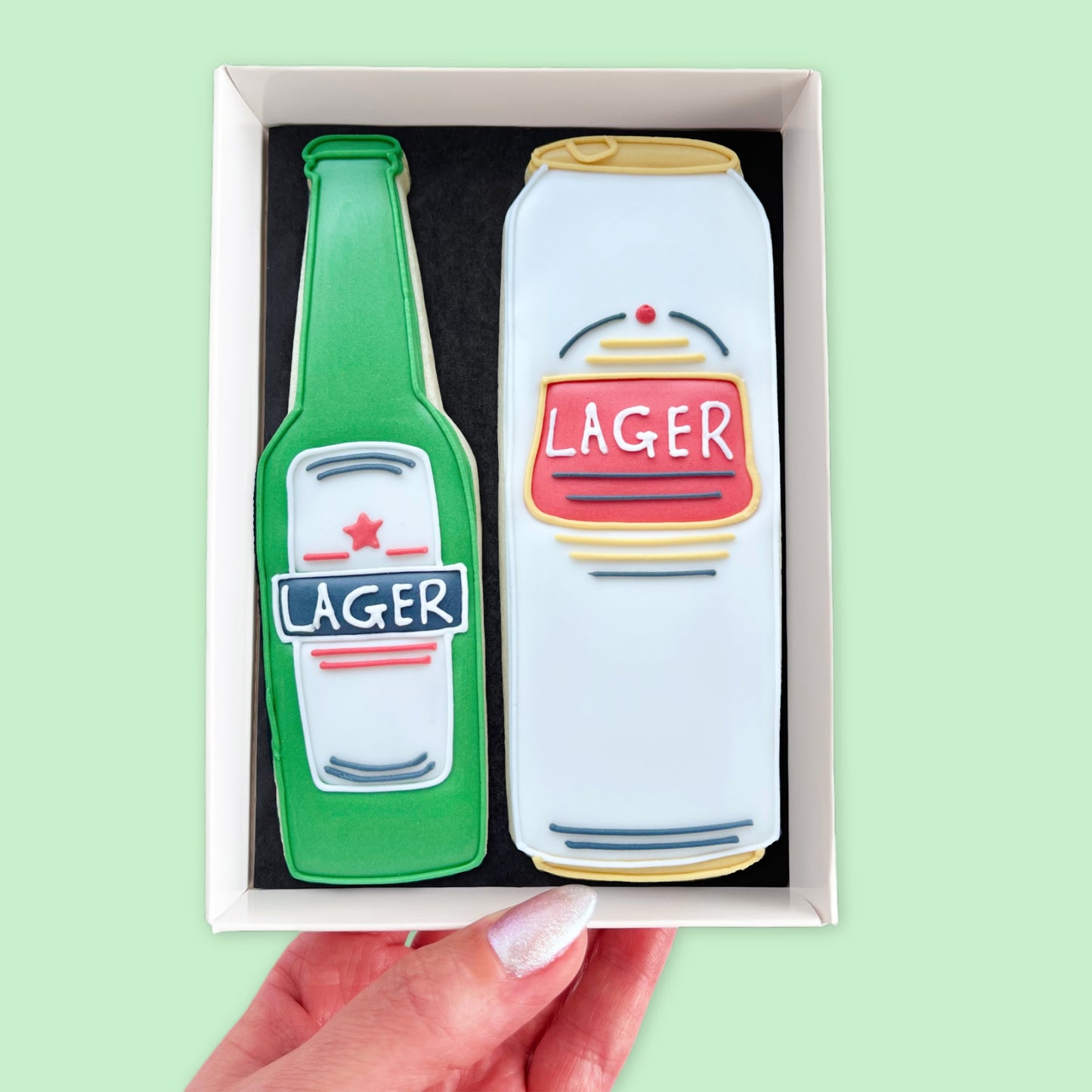Bottle and Can of lager Iced Biscuits