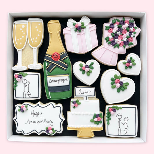 Hand Iced Anniversary themed biscuits in an open white gift box by Katie's Biscuit Shop sugar Anniversary